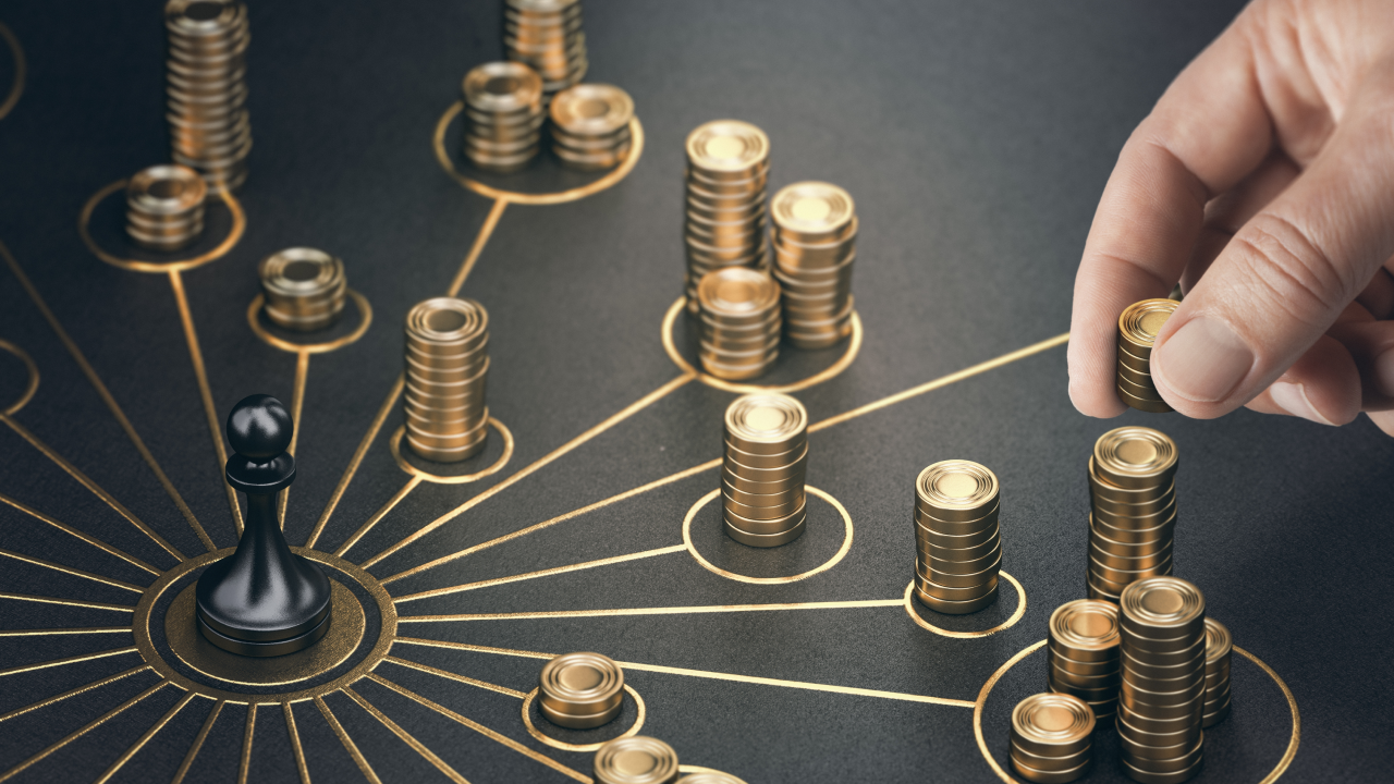 Understanding the Link Between Trade and Capital Flows, illustrated by a hand placing a stack of gold coins on a circular network diagram.