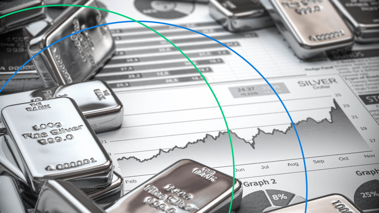 Silver bullion bars placed on financial charts and graphs, analyzing silver trading trends and market performance for beginner traders.