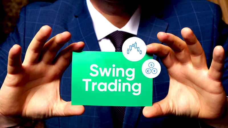 Person in a blue suit holding a green card that reads "Swing Trading" with two icons above it