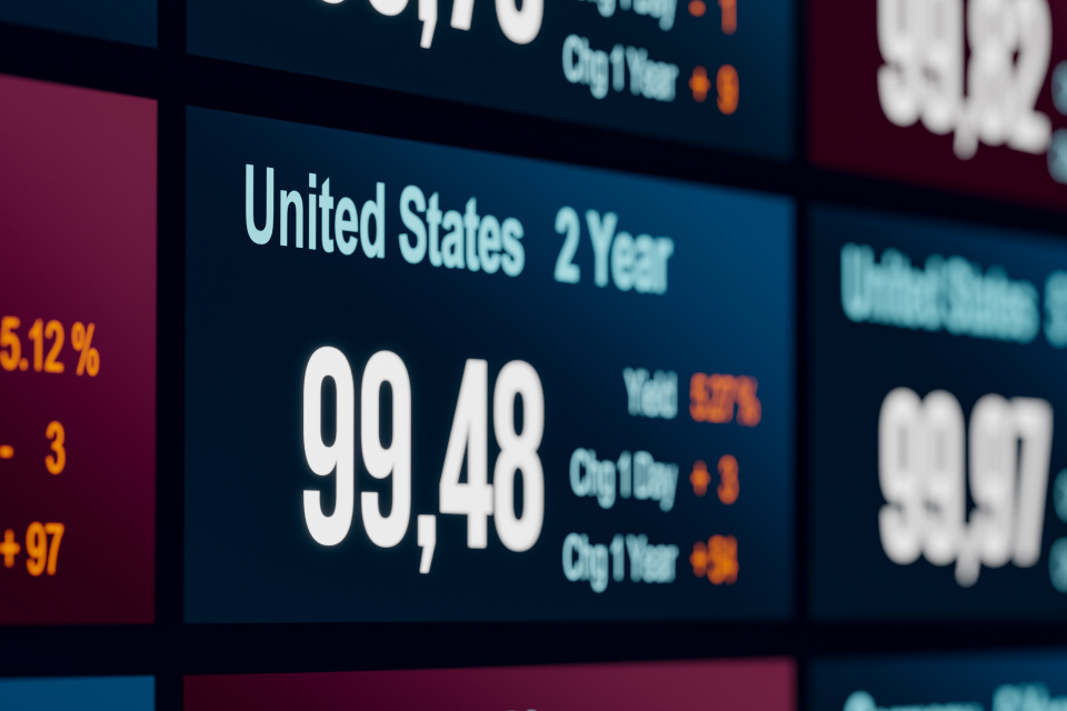 Treasury Bonds vs. Treasury Notes vs. Treasury Bills, illustrated by a digital display board showcasing U.S. Treasury yields.