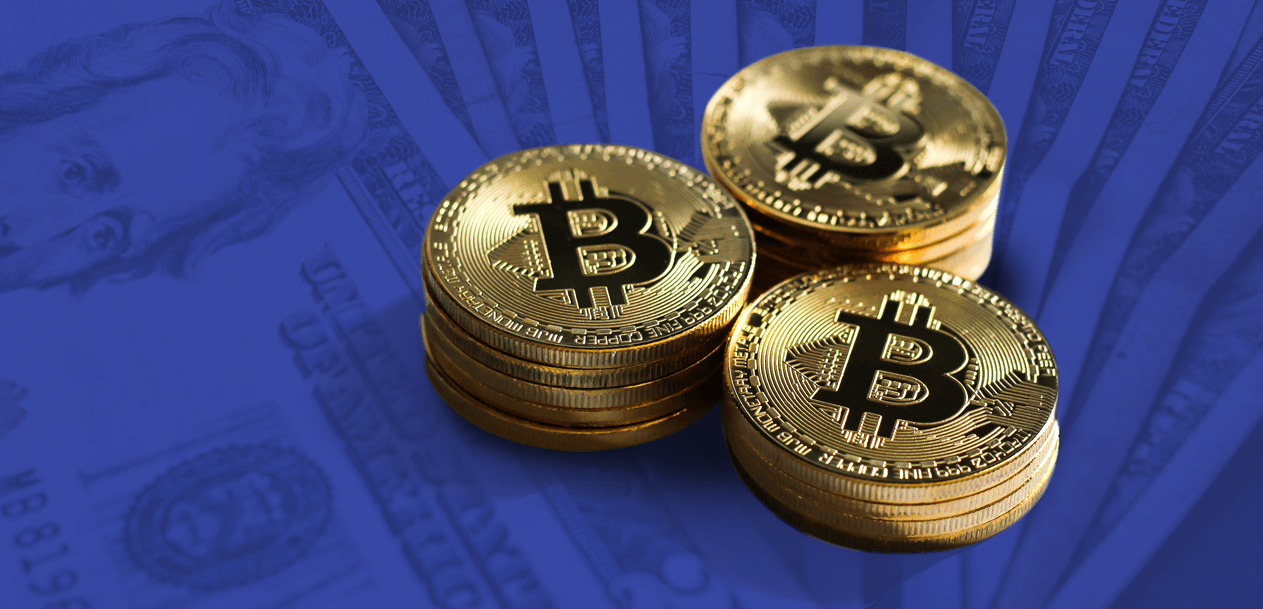 Can Bitcoin Eventually Become (Or Replace) The US Dollar As A Reserve Currency? – A stack of golden Bitcoin coins placed against a blue-toned background featuring US dollar bills, symbolizing the debate on Bitcoin's potential as a global reserve currency.