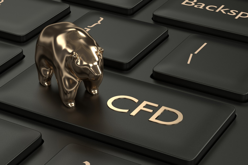 A Beginner's Guide to Contract for Differences (CFDs), featuring a golden bear figurine on a black keyboard with 'CFD' key.