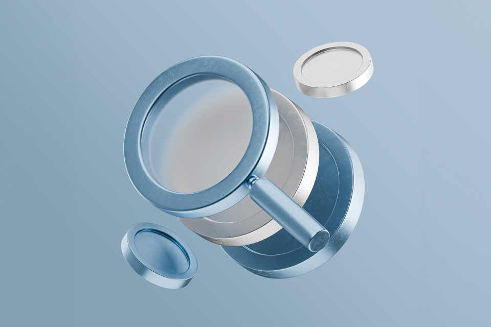A conceptual 3D-rendered illustration of a magnifying glass with a blue metallic frame and floating circular elements, symbolizing analysis and measurement, representing "Average True Range: What It Is and How to Calculate It."