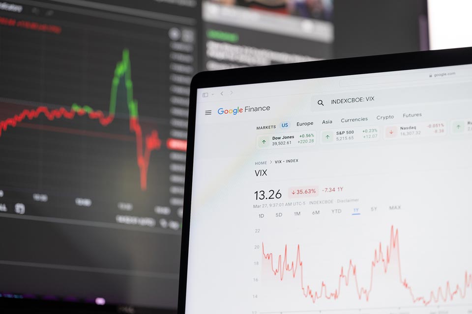 Computer screen displaying Google Finance with the VIX index and charts, illustrating top forex volatility indicators.