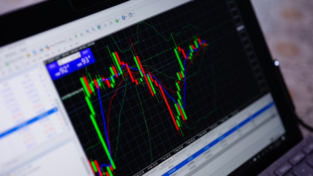 Trading with MetaTrader's Forex Volume Indicator displayed on a computer screen, showing chart analysis tools and market data.