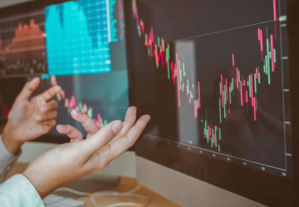 Traders analyzing divergence patterns on a financial chart, illustrating divergence trading and how to navigate around it