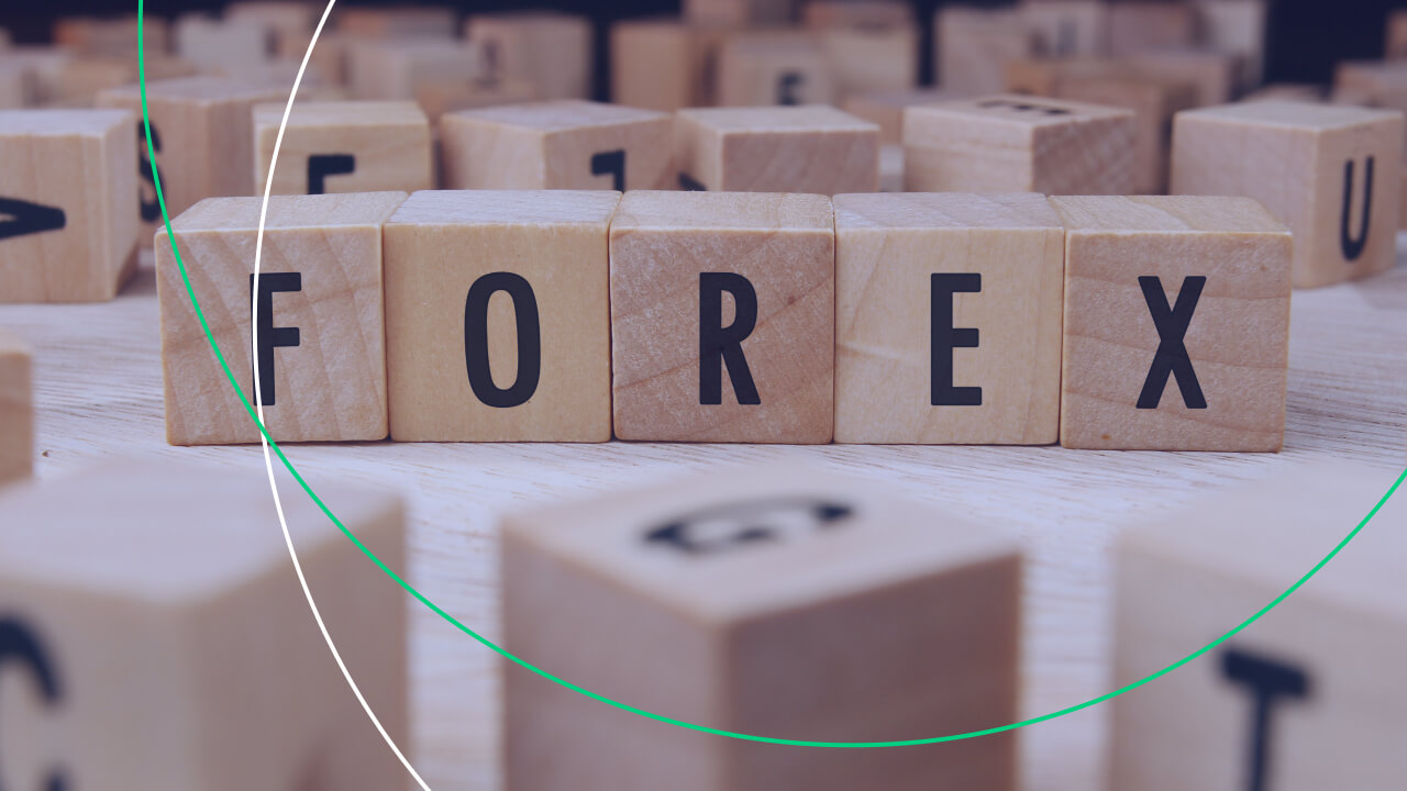 The image displays wooden letter blocks arranged to spell "FOREX", representing the foreign exchange market.