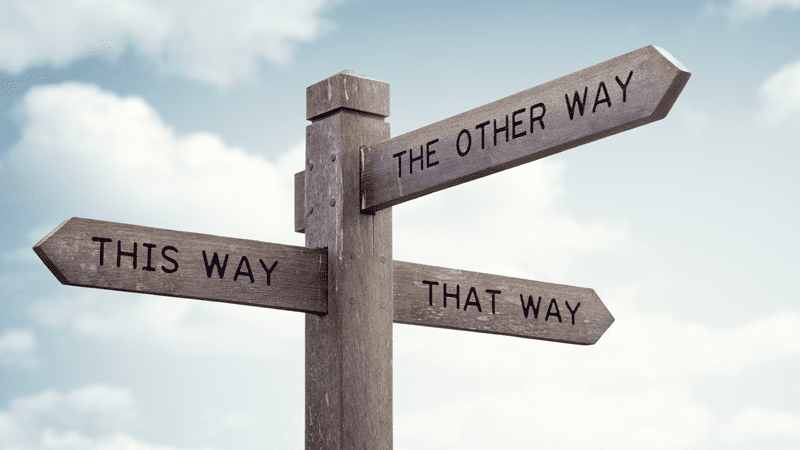 sign showing the other way, this way, that way