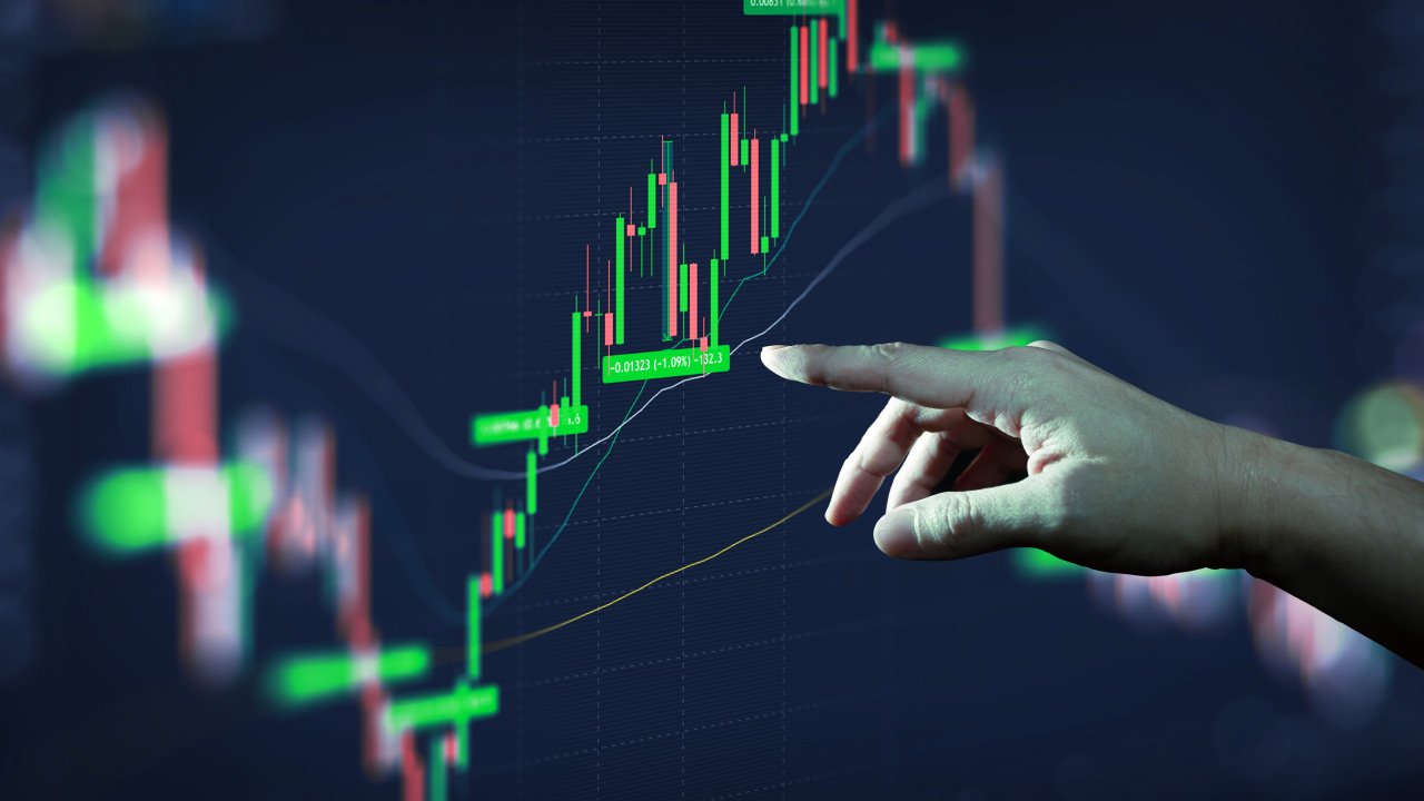 "Hand pointing at a digital forex trading chart showing green candlesticks and profit percentage labels during an upward trend.