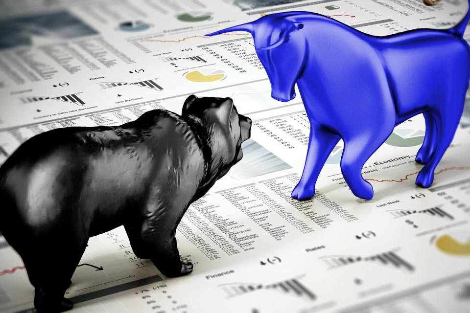 A 3D-rendered illustration of a black bear and a blue bull facing off on top of financial charts and market data, symbolizing the concept of "Bearish and Bullish Markets: What is the Difference?"