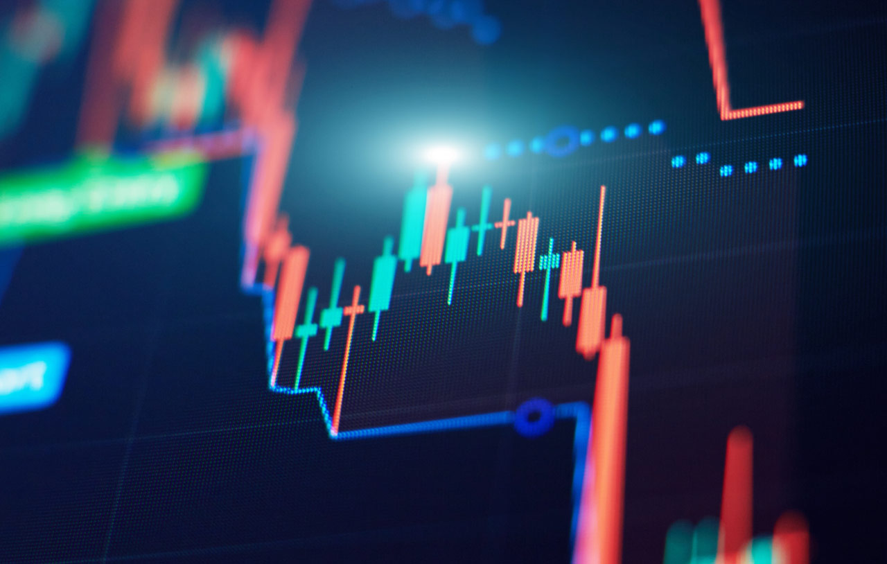 Butterfly Pattern Trading: A Comprehensive Guide – A close-up of a digital financial chart displaying red and green candlestick patterns with glowing highlights, illustrating market analysis and trading strategies.