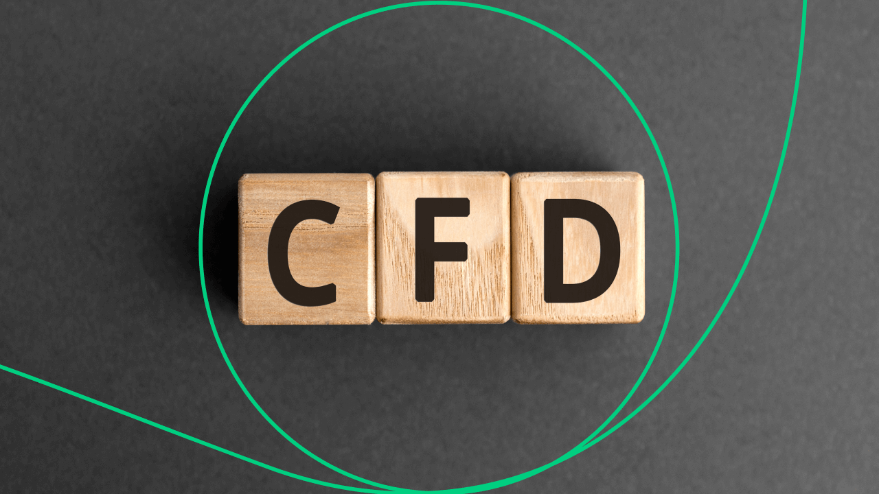 Wooden blocks spelling 'CFD' on a dark background, representing key principles of CFD trading. Learn the 10 important rules for CFD trading.