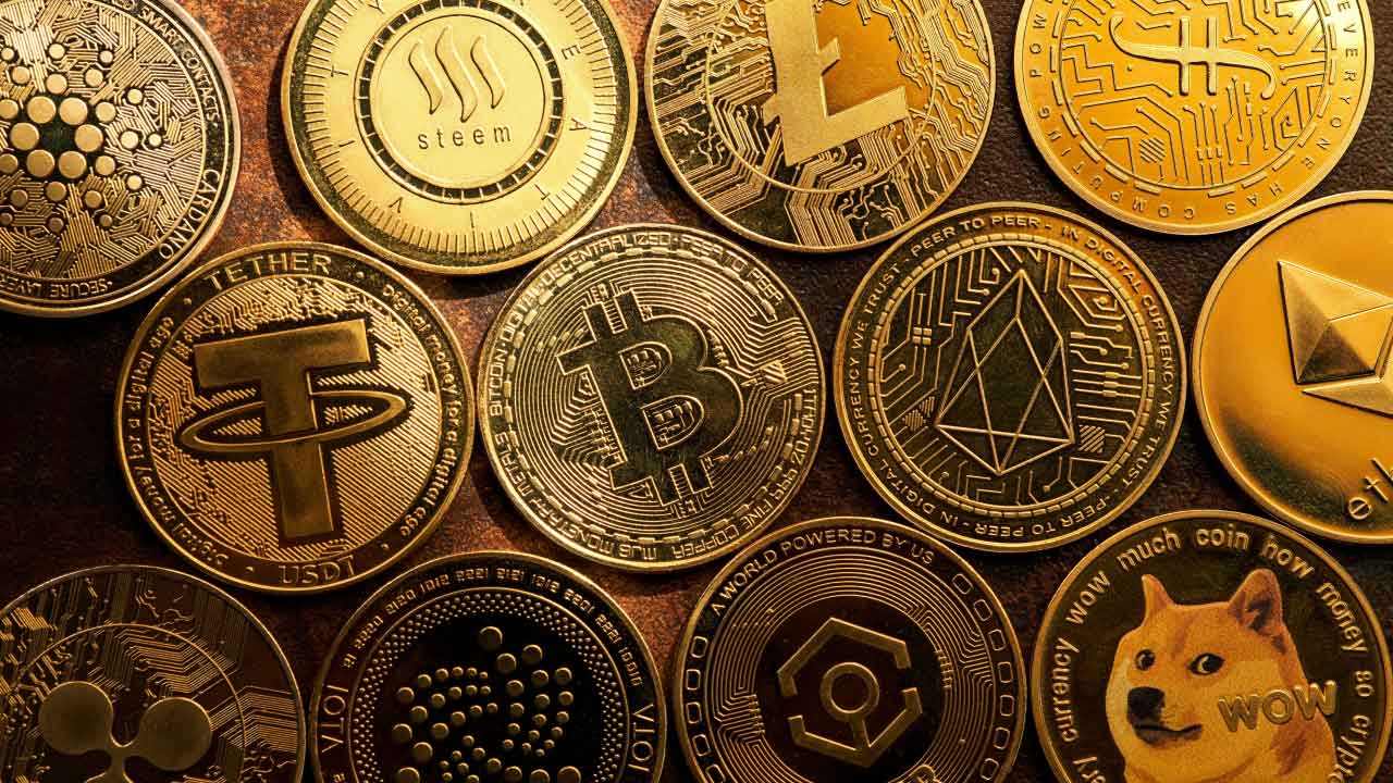 The Year Ahead: Top Crypto Predictions for 2024, illustrated by gold cryptocurrency coins.