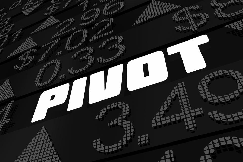 Digital display featuring the word 'PIVOT' in bold text surrounded by numerical data, illustrating top pivot point strategies in forex trading.