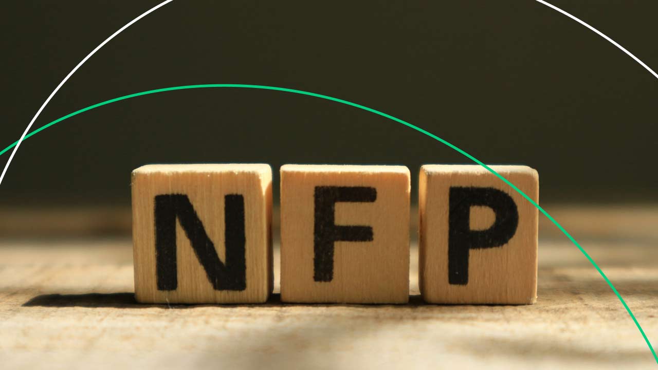 Non-Farm Payrolls and Forex: Everything You Need to Know, illustrated by wooden blocks displaying the letters "NFP".