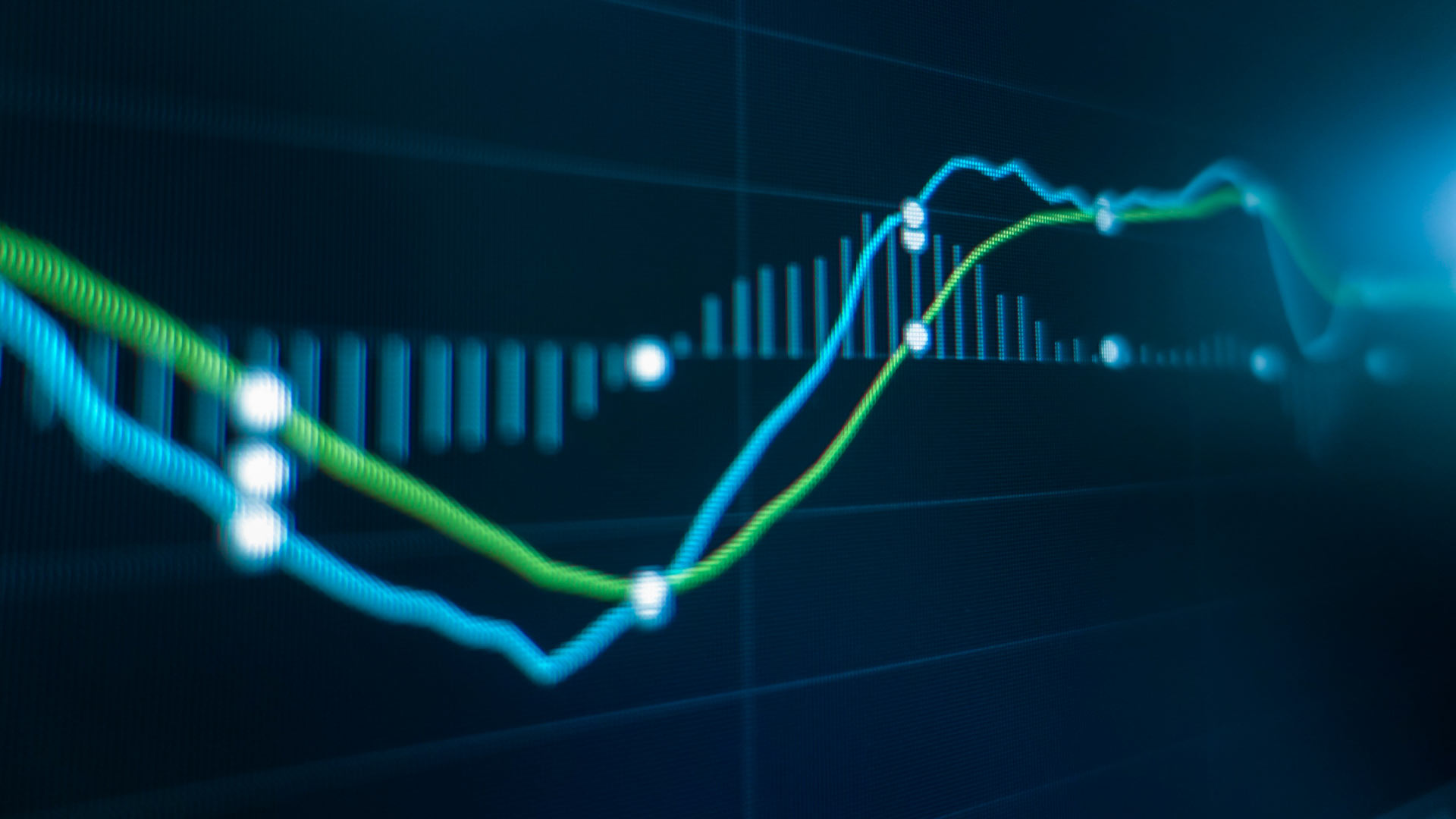 Financial chart displaying a golden cross pattern with moving averages crossing, indicating a potential bullish trend in trading.