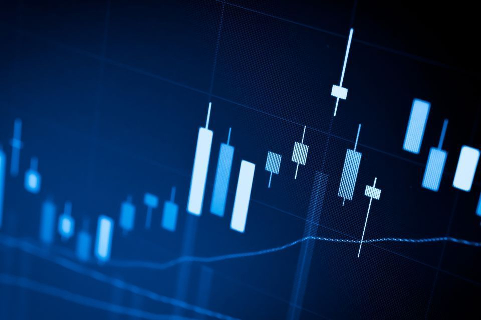 A digital financial chart displaying candlestick patterns and trend lines, representing the Simple Moving Average (SMA) for market analysis.