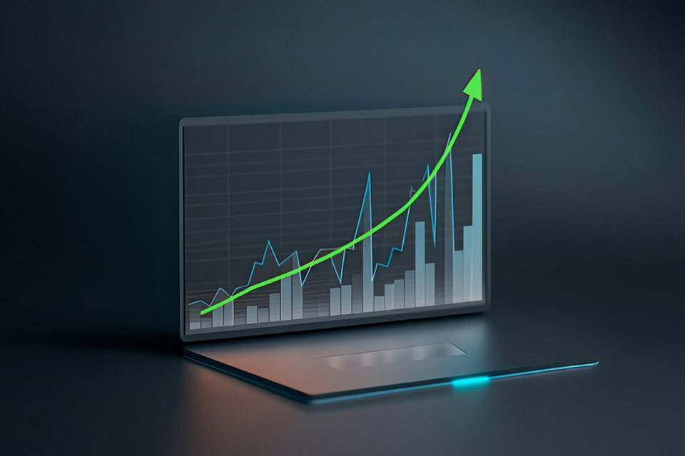 an upward trending chart displayed on a laptop screen