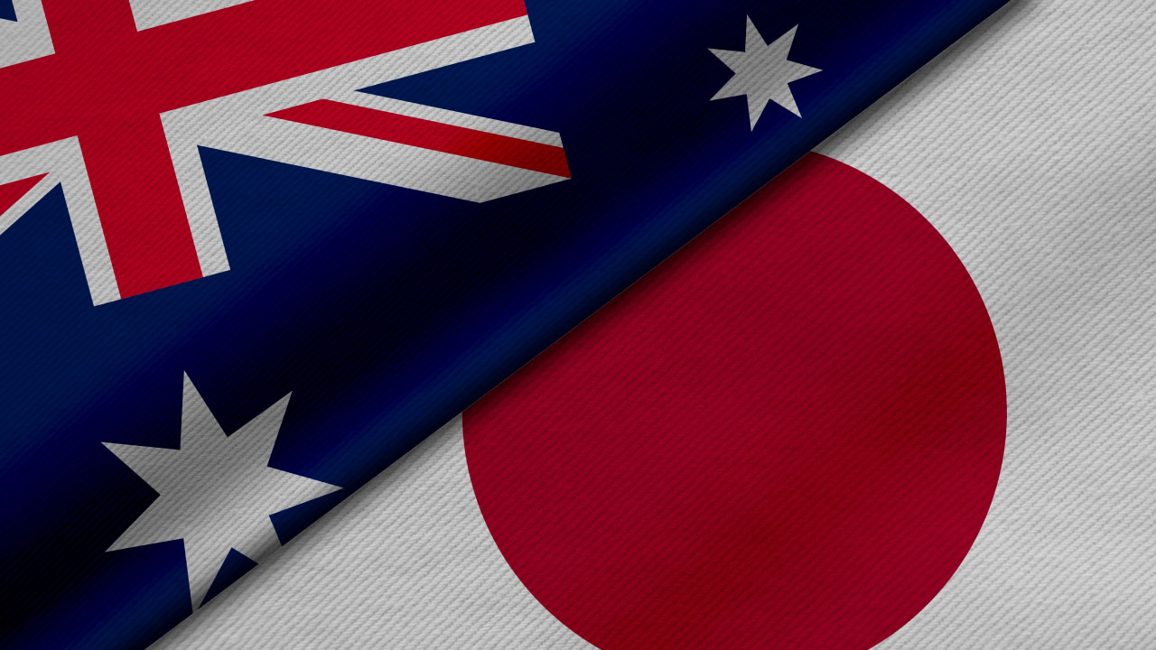 Australian and Japanese flags merged diagonally, representing the AUD/JPY currency pair in forex trading.