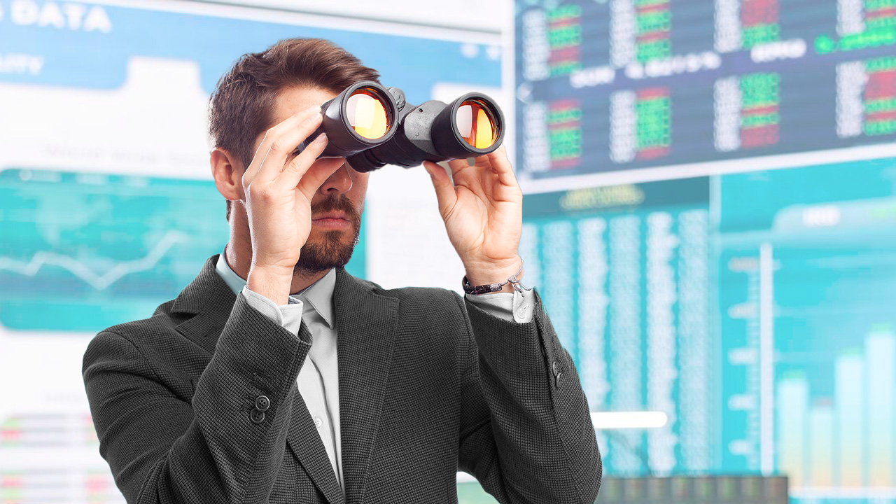 Exploring Exotic Forex Pairs: Opportunities and Risks – A trader in a suit using binoculars, analyzing financial data on multiple digital screens displaying market charts and currency exchange rates.