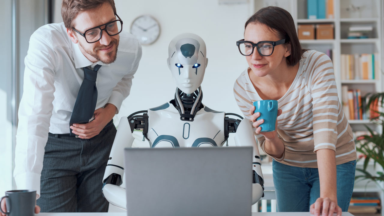 Two professionals analyzing data on a laptop with an AI-powered humanoid robot, representing automated trading with MetaTrader 4.