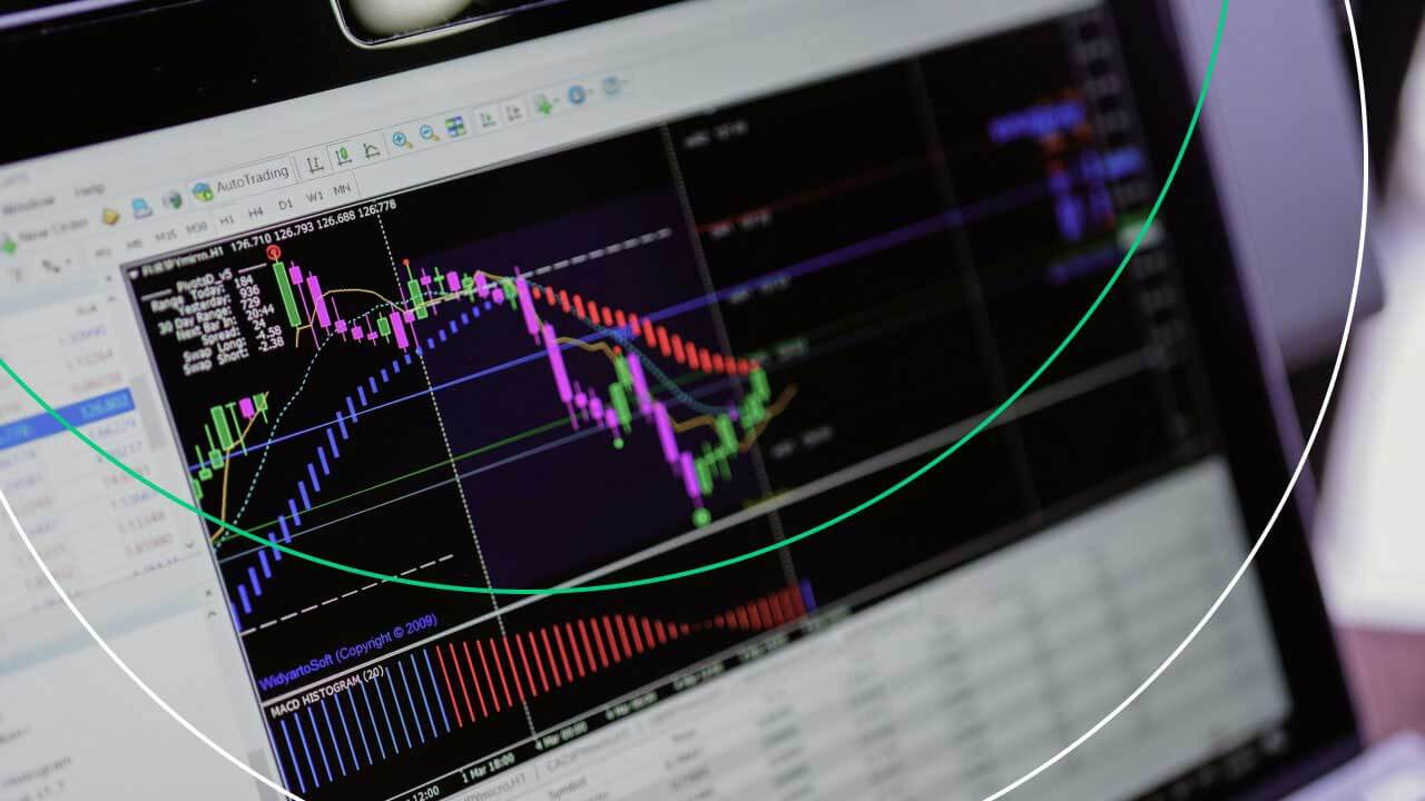 MetaTrader 4: Top Tips and Tricks — a computer screen displaying a complex trading chart with colorful indicators and candlestick patterns.