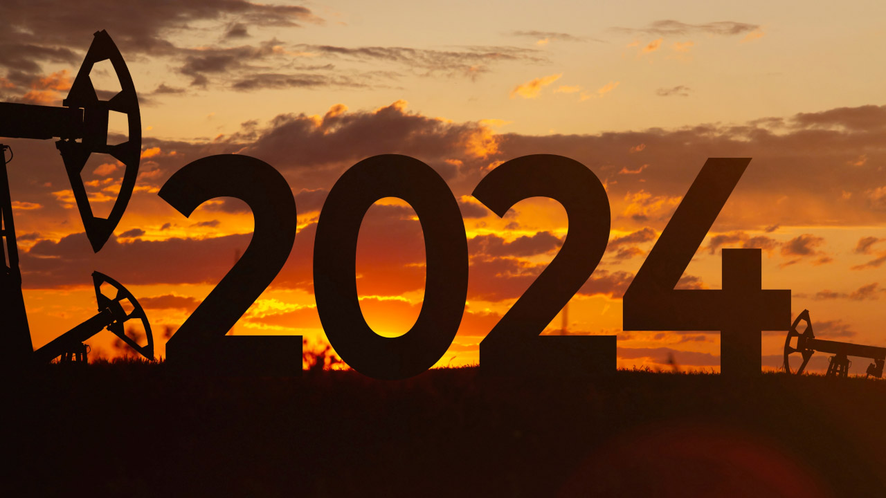 Silhouette of large "2024" numbers set against a sunset, illustrating the concept of what higher oil prices in 2024 could mean for the markets.