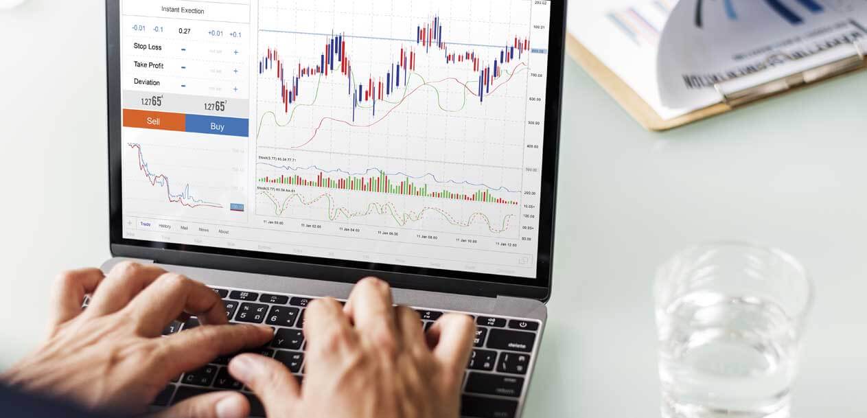The Basics Of Opening A Forex Account, illustrated by a person analyzing forex trading charts on a laptop with buy and sell options displayed on the screen.